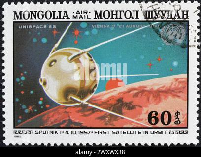 Briefmarke, gedruckt von der Mongolei, die die Raumfahrtforschung fördert. Stockfoto
