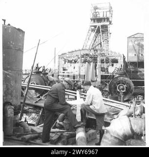 DIE NORDDEUTSCHE KOHLEKONTROLLE - Herr Williams spricht mit dem Bergbauingenieur über den Fortschritt der Reparaturen. , Britische Rheinarmee Stockfoto