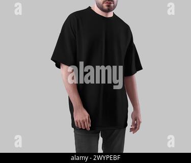 Übergroße schwarze T-Shirt-Vorlage auf bärtigen Mann in Jeans, Vorderansicht, isoliert auf Hintergrund. Hemd für Design, Druck, Muster, Branding. Modell von fa Stockfoto