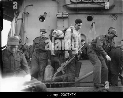 Die USS Tuscaloosa erreichte Greenock am 25. Oktober 1943 mit geretteten Norwegern und dem führenden britischen Radiomechaniker H.L. Hollings aus Spitzbergen. Stockfoto