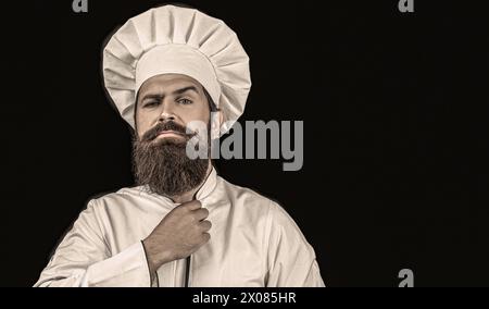 Bärtige Köche, Köche oder Bäcker. Bärtige männliche Köche. Kochmütze. Selbstbewusster bärtiger männlicher Koch in weißer Uniform. Seriöser Koch in weißer Uniform, Kochmütze Stockfoto