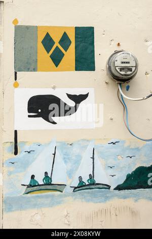 Straßenkunst mit einem Wal, Fischern, Walfängern und der Nationalflagge, Port Elizabeth, Bequia Island, St. Vincent und die Grenadinen, Karibik Stockfoto