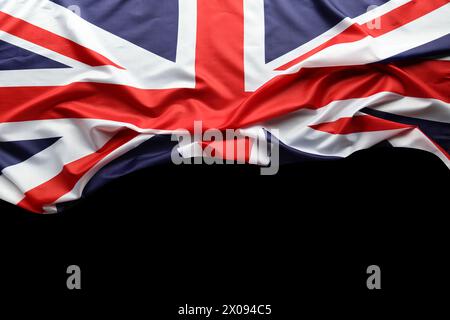 Union Jack-Flagge auf schwarzem Hintergrund Stockfoto