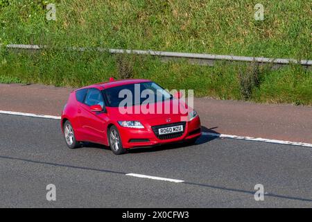 2010 Red Honda CR-Z SP i-VTEC IMA Hybrid, 1497 ccm, 16-Ventil-VTEC-Benzinwagen, der auf der Autobahn M6 fährt, Großbritannien Stockfoto