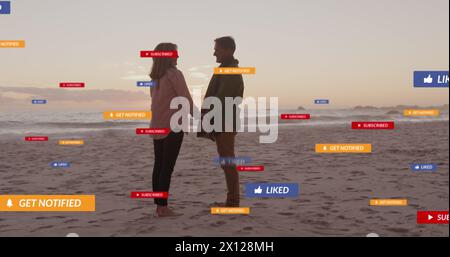 Bild von Social-Media-Texten und Symbolen über weißem Paar am Strand Stockfoto