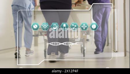 Bild von dna-Strang und Ikonen über verschiedene Ärzte im Krankenhaus Stockfoto