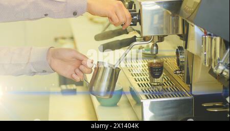 Abbildung: Glühende, bewegliche Lichter über der Kaffeemaschine Stockfoto