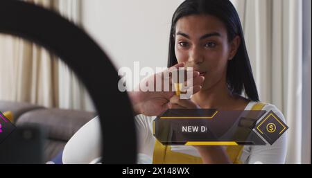 Bild von Social-Media-Daten und -Ikonen über birassische Frau auf Make-up-Vlog Stockfoto