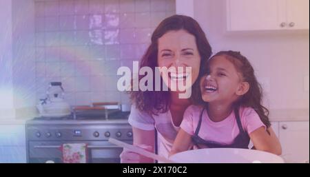 Bild von Lichtern über glücklicher kaukasischer Mutter und Tochter, die zusammen kochen Stockfoto