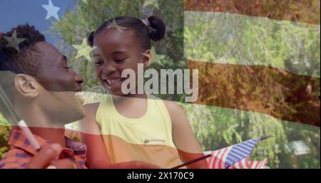 Bild der usa-Flagge über glücklichem afroamerikanischen Vater und Tochter mit ua-Fahnen Stockfoto