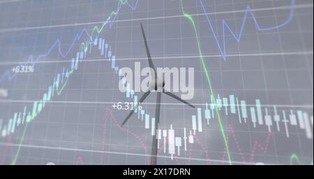 Abbildung mehrerer Diagramme mit wechselnden Zahlen, rotierende Windmühlen auf grünem Feld gegen Himmel Stockfoto