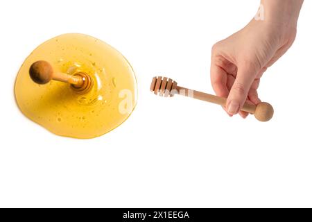 Honiglapper in der Frauenhand isoliert auf weißem Hintergrund. Stockfoto