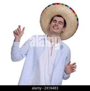 Junger Mann mit mexikanischem Sombrero-Hut, der auf weißem Hintergrund tanzt Stockfoto