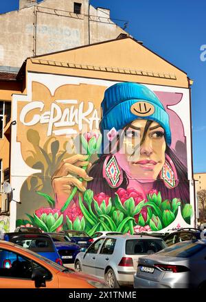 Serdika Tulpe großes Graffiti-Wandbild, das junge Frau mit Tulpenblumen auf einem Parkplatz in Sofia Bulgarien, Osteuropa, Balkan, EU zeigt Stockfoto