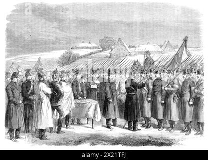 Der Krieg in Schleswig: Medaillen an österreichische Truppen in Hoptrup - nach einer Skizze unseres Sonderkünstlers, 1864. Der Sketch... wurde in Hoptrup, einem Dorf 8 Meilen von Hadersleben [dh Haderslev, Dänemark], anlässlich der Übergabe der Medaillen an die österreichische Brigade Gondrecourt für ihr gutes Verhalten während der Schlacht von Oversee genommen. Fürst Albrecht von Preußen wird in der Tat gesehen, die Medaille am Mantel eines der österreichischen Soldaten zu befestigen. Der österreichische Kommandeur General von Gablenz steht mit seiner linken Hand oder etwas hinter ihm genau in der Bildmitte. Im linken Stockfoto