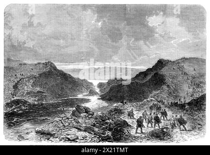 The Bradfield Reservoir, nahe Sheffield: The Gap in the Dale Dyke Damm - nach einem Entwurf unseres Künstlers, 1864. Schauplatz von "A furchtbar disaster...involving, die plötzliche Zerstörung von mehreren hundert Menschenleben... durch das Platzen des Reservoirs der Sheffield Water Company in Bradfield... Wir sehen, was für eine Lücke am Dale Dyke Embankment entstand, sauberer Schnitt weg vom Hügel auf jeder Seite... Wir könnten versuchen, die plötzliche Ausströmung von 100 Millionen Kubikfuß Wasser durch diesen Kanal zu begreifen - das heißt, zwei Millionen Tonnen Wasser, das alle auf einmal in die Täler darunter fließen Stockfoto