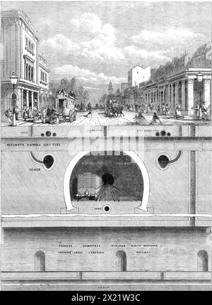 Unterirdische Arbeiten an der Kreuzung von Hampstead-Road, Euston-Road und Tottenham-Court-Road, 1864. Ansicht, die zeigt, welche umfangreichen unterirdischen Werke in verschiedenen Teilen Londons gebaut werden, die aber auf der Oberfläche nicht zu sehen sind. und deren Existenz ist wahrscheinlich einem sehr großen Teil der Bewohner unbekannt... täglich über die Stätte zu laufen... die Linien verschiedener Werke kreuzen sich [hier]. Es gibt zunächst direkt unter der Straßenoberfläche einen doppelten Satz von Leitungen und Leitungen für die Versorgung von Wasser und Gas. Unter diesen Pässen, quer, das Stockfoto