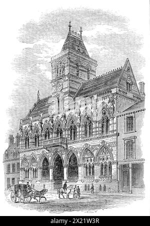 Das neue Rathaus von Northampton, 1864. Der Architekt der neuen Halle ist Mr. Edwin Godwin aus Bristol; Mr. John Watkin ist der Baumeister. Das Design ist gotisch, wie aus unserer Abbildung hervorgeht. Die Statuen von Mr. Boulton aus Worcester, die die Vorderseite des Gebäudes zieren, stellen St. George, St. Michael, Richard I., Heinrich III., Edward I., Edward IV., Heinrich VII. und Königin Victoria. Es gibt skulpturierte Gruppen von Themen aus der englischen Geschichte auf den Bögen der unteren Fenster, und viele andere Dekorationen, die uns unser begrenzter Raum nicht erlauben wird, zu beschreiben. Bei der Ankunft Stockfoto