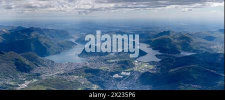 Luftlandschaft, aus einem Segelflugzeug, von Lugano See und Stadt, aufgenommen von Norden im hellen Frühlingslicht, Alpen, Tessin, Schweiz Stockfoto