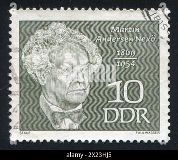 DEUTSCHLAND - CA. 1969: Briefmarke gedruckt von Deutschland, zeigt Martin Andersen Nexo, dänischer Schriftsteller, ca. 1969 Stockfoto