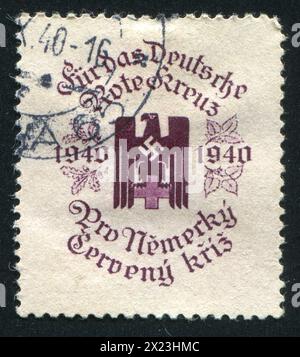 TSCHECHOSLOWAKEI - UM 1940: Stempel gedruckt von der Tschechoslowakei, zeigt deutsches Rotes Kreuz. Dieses Bild ist keine Nazi-Propaganda, um 1940 Stockfoto