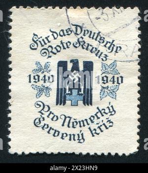 TSCHECHOSLOWAKEI - UM 1940: Stempel gedruckt von der Tschechoslowakei, zeigt deutsches Rotes Kreuz. Dieses Bild ist keine Nazi-Propaganda, um 1940 Stockfoto