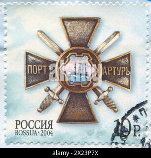 RUSSLAND - CIRCA 2004: Briefmarke gedruckt von Russland, zeigt Verteidigung von Port Arthur (Lushun, China) im Russisch-Japanischen Krieg, um 2004 Stockfoto