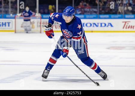 19. April 2024: Rochester-Amerikaner-Verteidiger Nikita Novikov (74) skatet in der zweiten Periode gegen die Cleveland Monsters. Die Rochester Americans veranstalteten die Cleveland Monsters in einem Spiel der American Hockey League in der Blue Cross Arena in Rochester, New York. (Jonathan Tenca/CSM) Stockfoto