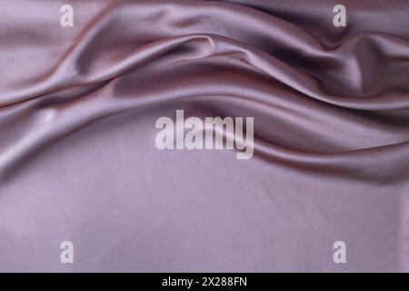 Glatte elegante rosa Seide oder Satin Luxus Stoff Textur kann als abstrakter Hintergrund verwenden. Luxuriöses Hintergrunddesign Stockfoto