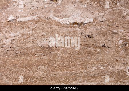 Travertinhintergrund in attraktivem Braunton, Teil des Designs. Stockfoto