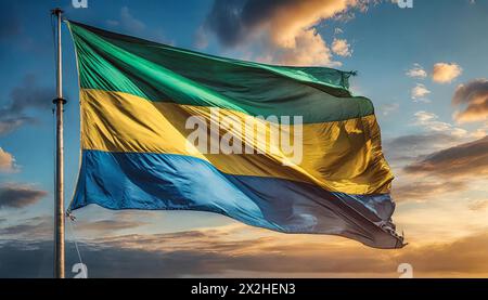 Die Fahne von Gabun flattert im Wind, isoliert gegen blauer Himmel Stockfoto