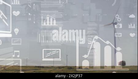 Bild der Datenverarbeitung und Diagramme über Windturbinen auf dem Feld Stockfoto