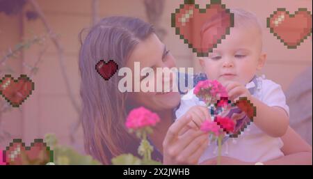 Bild von Herzsymbolen über der kaukasischen Mutter mit Baby, das eine Blume hält Stockfoto