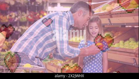 Bild von Herzsymbolen über dem kaukasischen Vater mit Tochter, die Zitrone hält Stockfoto