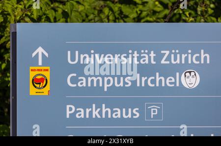 Auf einem Weg der Universität Zürich, Campus Irchel haben einige Personen aus dem politischen Linksextremen Spektrum einen Kleber angebracht, welcher BE Stockfoto