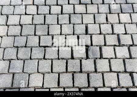 Hintergrund aus frisch gebliebenem Kopfsteinpflaster Stockfoto