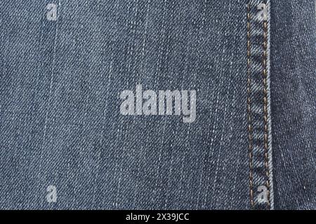 Blaue jeansstruktur. Leerer Textilinhalt aus Denim. Weiches Material. Flache Baumwolloberfläche. Grunge-Strukturkonstruktion. Dunkelmarineblaues Material. Indigo Vintage-Style. Kopierraum Stockfoto