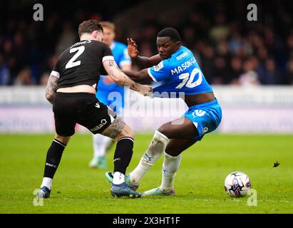 Gethin Jones von Bolton Wanderers und Jadel Katongo von Peterborough United kämpfen um den Ball während des Spiels der Sky Bet League One im Weston Homes Stadium in Peterborough. Bilddatum: Samstag, 27. April 2024. Stockfoto