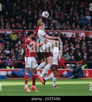 April 2024; The City Ground, Nottingham, England; Premier League Football, Nottingham Forest gegen Manchester City; Erling Haaland aus Manchester City räumt den Ball unter dem Druck von Andrew Omobamidele aus Nottingham Forest Stockfoto