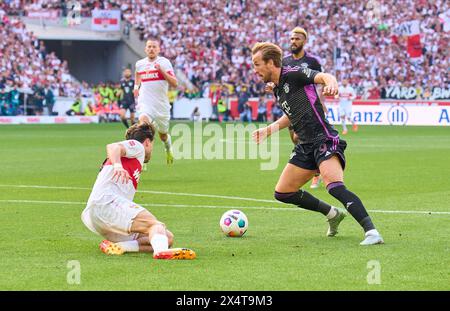 Stuttgart, Deutschland. Mai 2024. Harry Kane, FCB 9 tritt um den Ball an, Tackling, Duell, Header, zweikampf, Action, Kampf gegen Leonidas Stergiou VFB 20 im Spiel VFB STUTTGART - FC BAYERN MÜNCHEN 3-1 am 4. Mai 2024 in Stuttgart. Saison 2023/2024, 1.Bundesliga, Spieltag 32, 32.Spieltag, München, München Fotograf: ddp-Bilder/STAR-Bilder - DFL-VORSCHRIFTEN VERBIETEN JEDE VERWENDUNG VON FOTOGRAFIEN als BILDSEQUENZEN und/oder QUASI-VIDEO - Credit: ddp Media GmbH/Alamy Live News Stockfoto