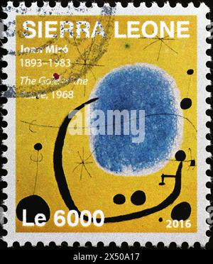 Blau-gelbes Gemälde von Joan Mirò auf Briefmarke Stockfoto