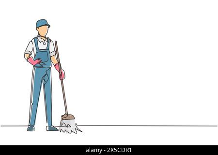 Durchgehende einzeilige Zeichnung lächelnder junger männlicher Hausmeister, der in Uniform steht, den Boden mit Besen fegt, professionelle Reinigung, Heim- und Bürodienst Stock Vektor