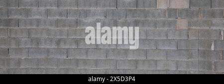 Alter grauer Zementhintergrund mit Betonblockwand Stockfoto