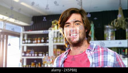 Bild von Ikonen, die mit Linien über dem kaukasier verbunden sind, der auf dem Handy spricht Stockfoto