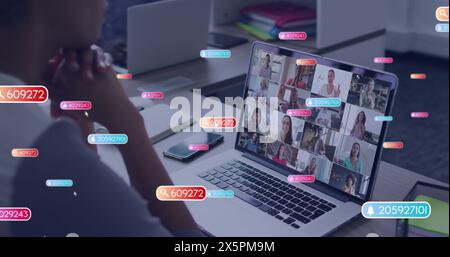 Bild von Social-Media-Ikonen und -Nummern über afroamerikanischer Frau bei Laptop-Image-Anruf Stockfoto