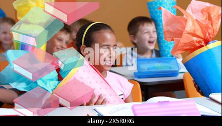 Bild von Büchern, die über glückliche Schulkinder im Klassenzimmer ziehen Stockfoto