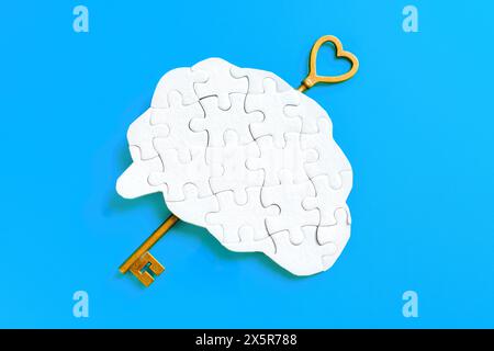 Langer Schlüssel, der in ein menschliches Gehirn-förmiges Puzzle auf blauem Hintergrund eingefügt wird, symbolisiert die Entfaltung von Potenzial und Wissen. Stockfoto
