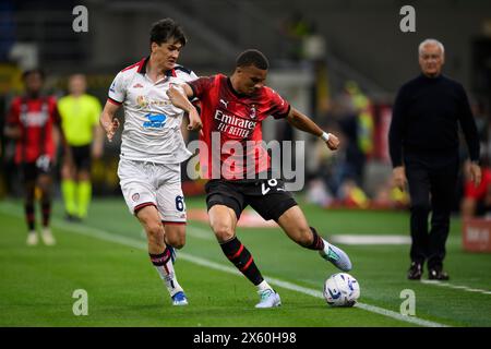 Mailand, Italien. 11. Mai 2024. Malick Thiaw vom AC Mailand tritt beim Fußball-Spiel der Serie A zwischen AC Mailand und Cagliari Calcio gegen Eldor Shomurodov von Cagliari Calcio um den Ball an. Quelle: Nicolò Campo/Alamy Live News Stockfoto