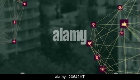 Bild von Kugeln mit digitalen Symbolen, die sich gegen die Luftaufnahme hoher Gebäude drehen Stockfoto