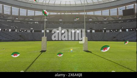 Bild von Rugbybällen mit Flagge von wales über dem Stadion Stockfoto